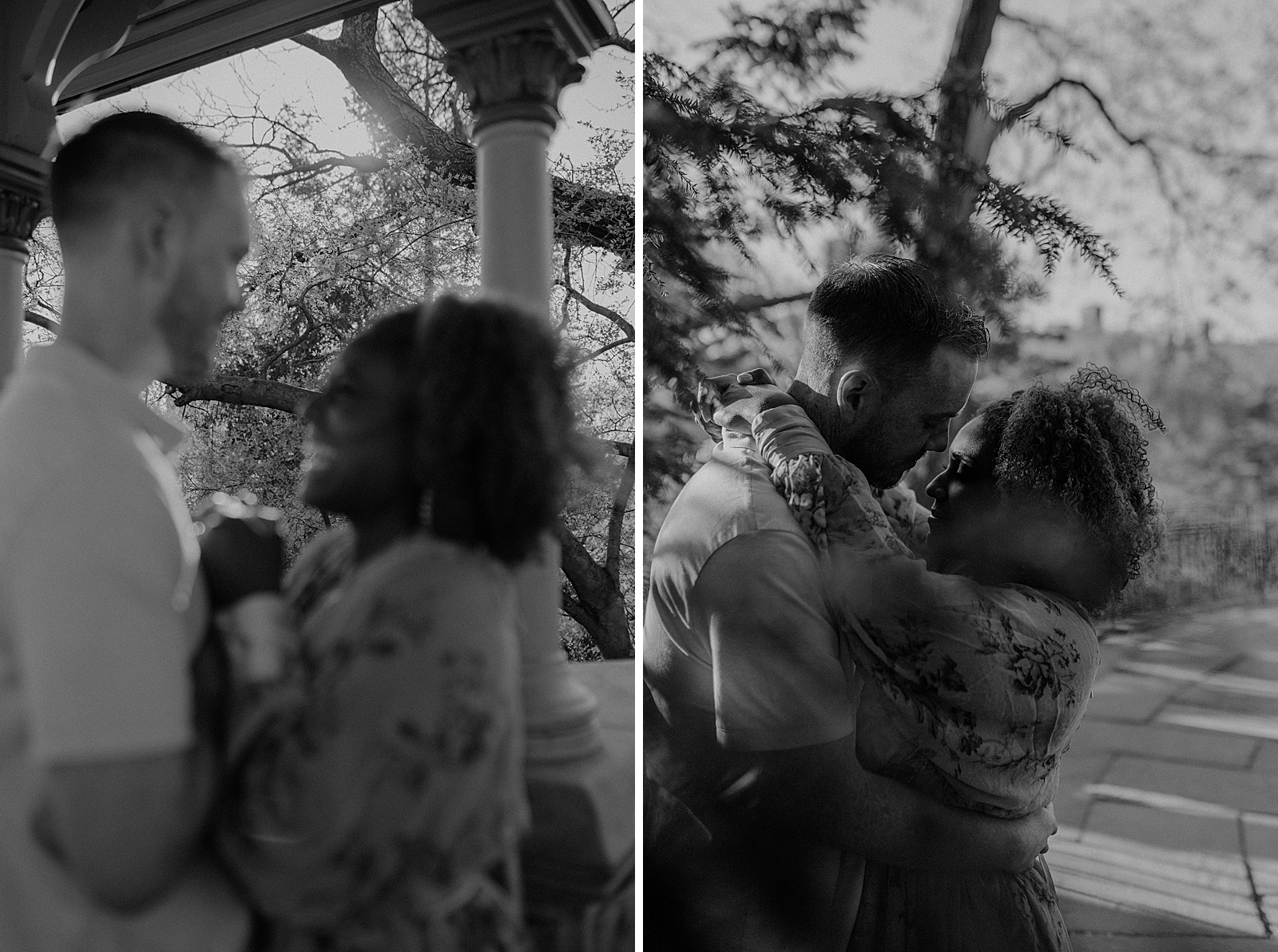 B&W blurry portrait of couple holding each other in front of trees