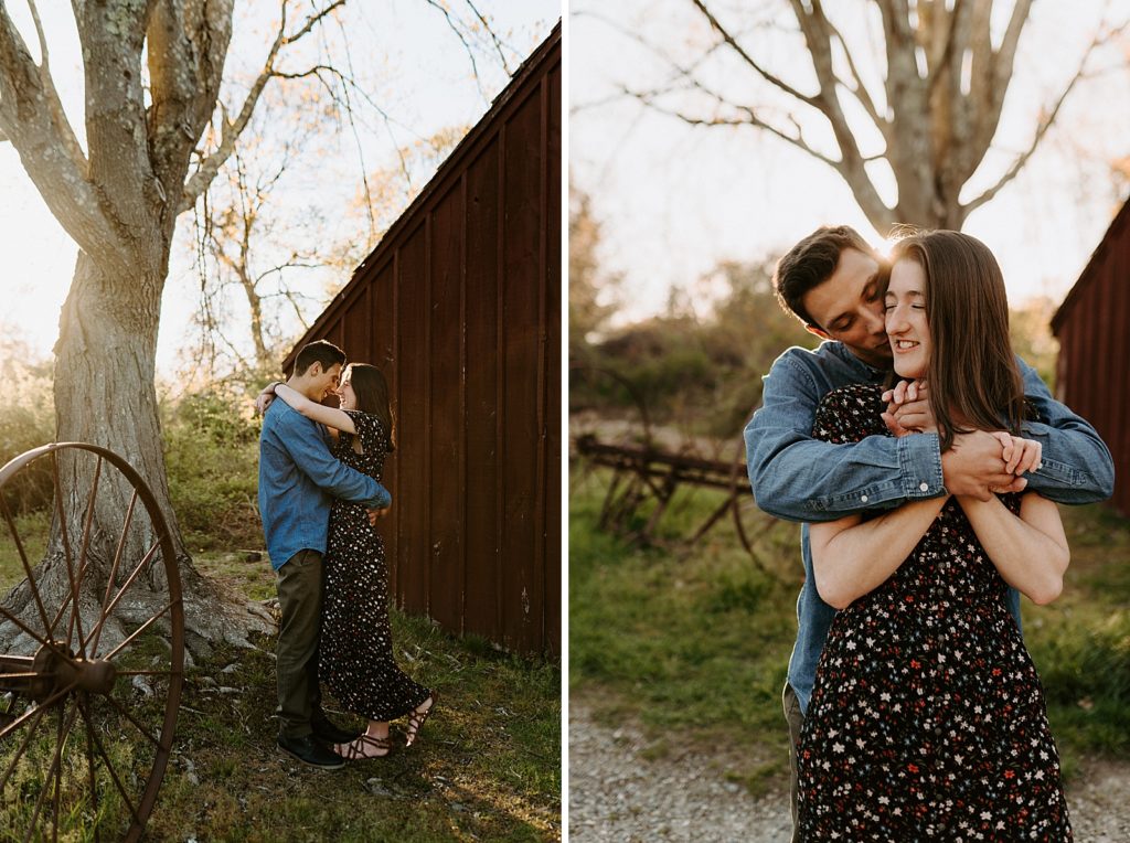 Couple holding each other outside in worn down forrest