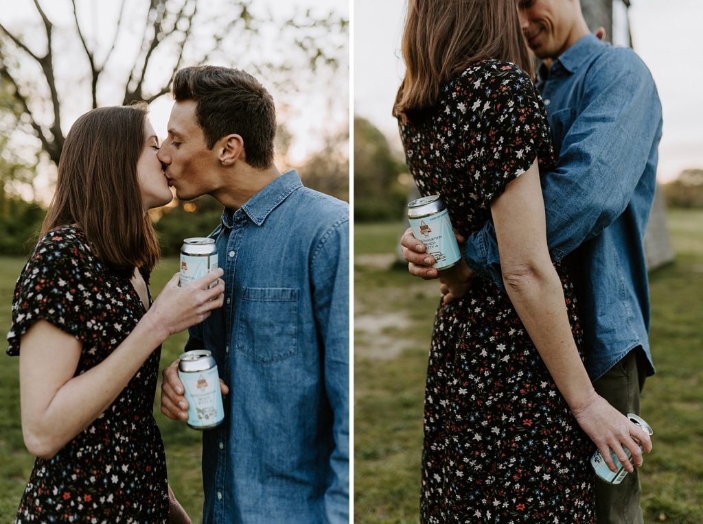 Couple kissing while hold cans of beer