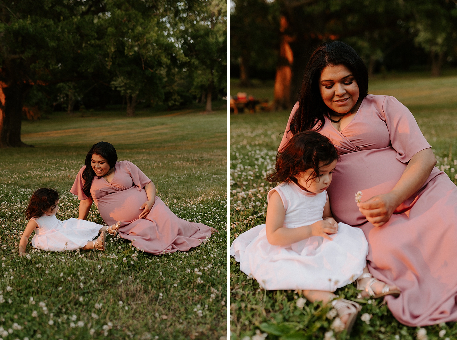Pregnant mother and daughter sitting on grass picking flowers off field