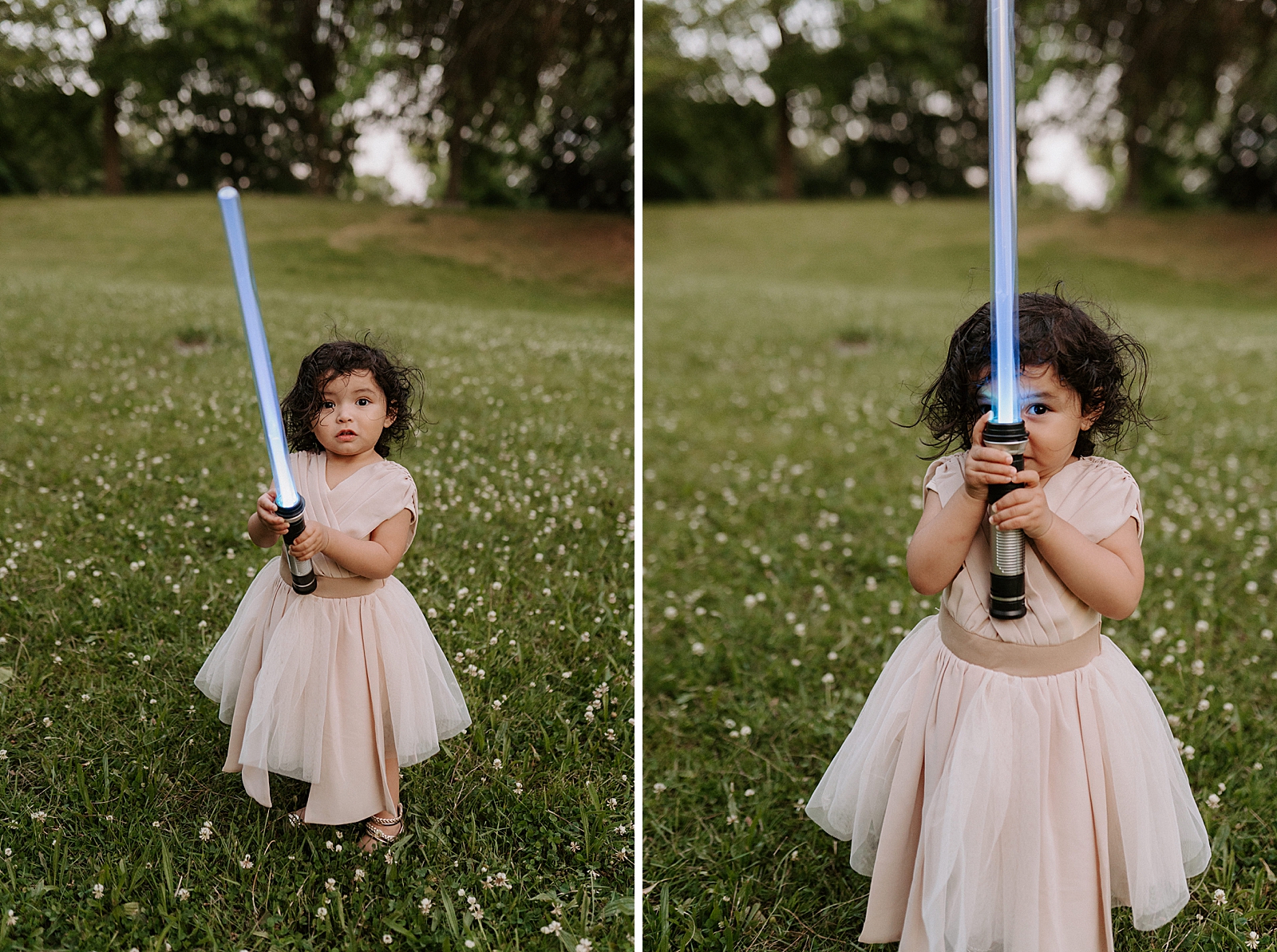 Toddler Daughter holding blue lightsaber on grassy field