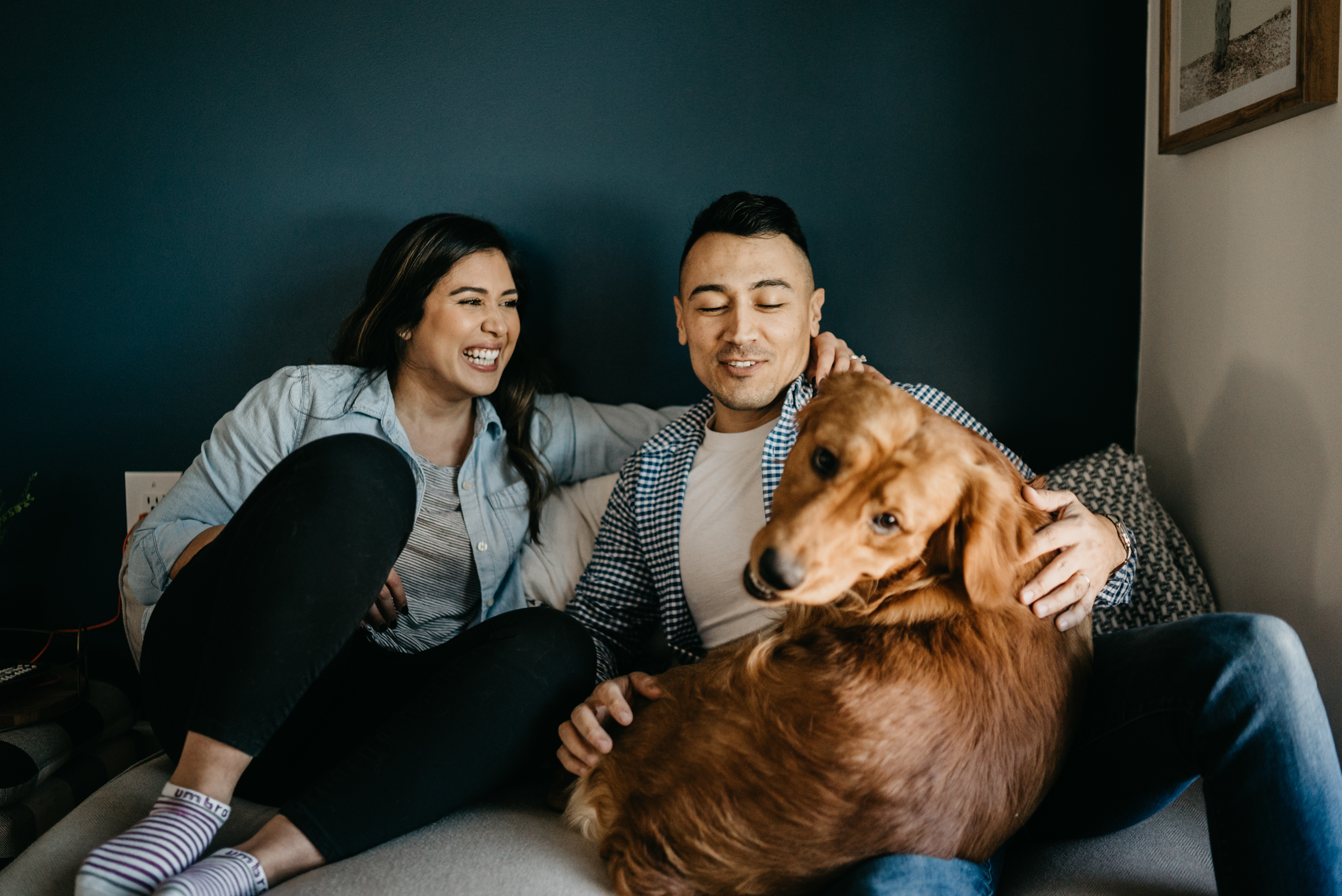 couple at home with their dog