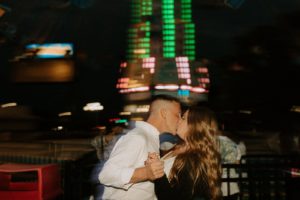 Motion blurred picture of couple kissing at night